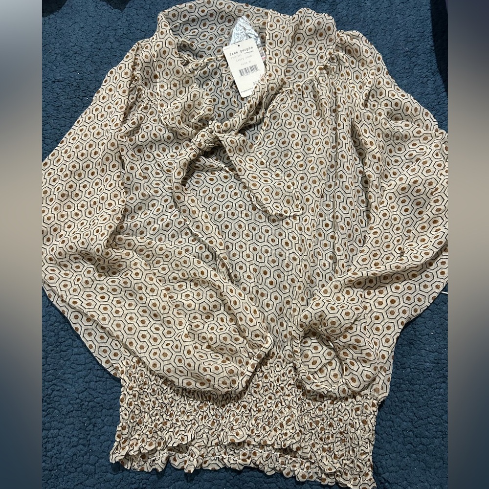 Free People see thru brown/Beige blouse. 
Brand new with tags